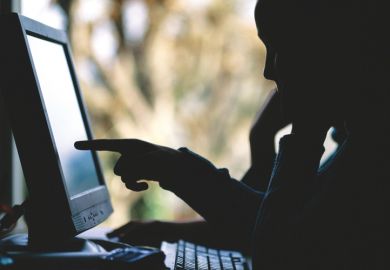 Silhouette of people using desktop PC