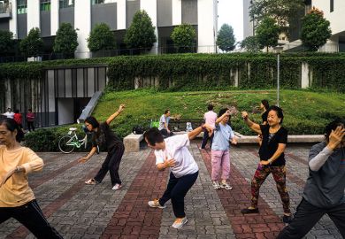 People practise tai chi in Singapore