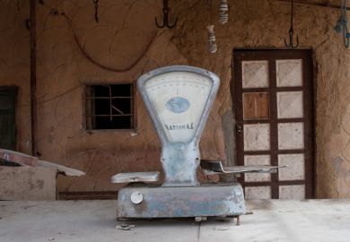 Dusty set of scales outside a closed shop in Siwa, Egypt, 2018