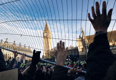 Student fees protesters attempt to throw a fence at police in Parliament Square in December 2010 in London Student fees protesters attempt to throw a fence at police in Parliament Square in December 2010 in London