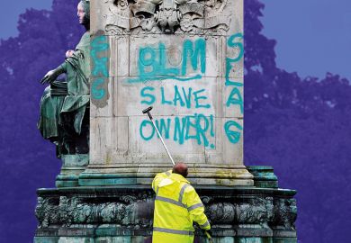 Council workers clean a statue of Queen Victoria in Woodhouse Moor Park in Leeds, 2020