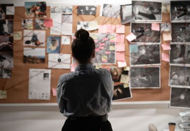 A detective studying an investigation board A detective studying an investigation board, symbolising data sleuthing