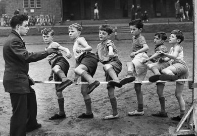 Cubs from London train at Ladywell Park for their athletes Proficiency Badge, by stepping over a low high jump, 1955. To illustrate contextual offers / lower entry requirements.