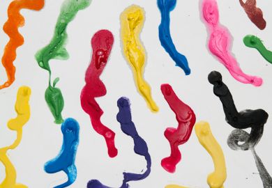 Splashes of coloured paint on white canvas