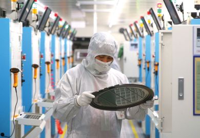 Employees work on the production line of silicon wafer at a factory of GalaxyCore Inc. to illustrate ndustry-focused universities tackle Chinese skills gaps