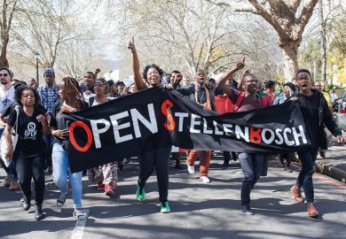Students hold banners during a demonstration against Stellenbosch University in Cape Town, 2015.