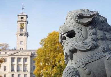 Stone lion in front of Nottingham University's Trent Building Stone lion in front of Nottingham University's Trent Building