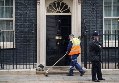 Street cleaner outside Downing Street