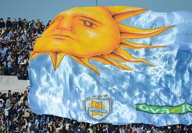 A flag passes over the crowd in Uruguay