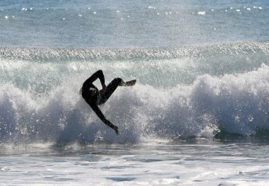 Surfer wiping out on wave, Mojácar, spain