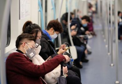 People on subway wearing surgical masks