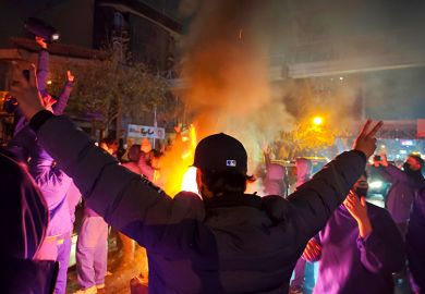 Fires are lit as protesters rally on 8 January, 2026 in Tehran, Iran. Demonstrations have been ongoing since December, triggered by soaring inflation and the collapse of the rial, and have expanded into broader demands for political change. 