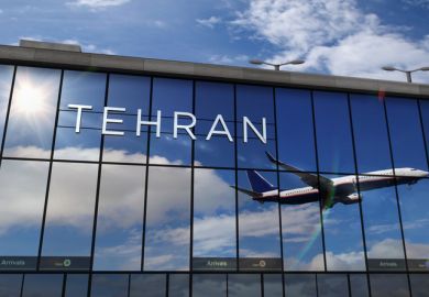 A plane reflected in the glass of Tehran airport