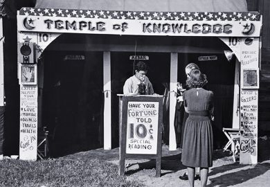 Historical photo of a fortune teller's booth, the Temple of Knowledge, showing advertising posters, admission taker, and two women customers waiting their turns. To illustrate that admissions on predicted A-level grades look foolish in AI era. Historical photo of a fortune teller's booth, the Temple of Knowledge, showing advertising posters, admission taker, and two women customers waiting their turns. To illustrate that admissions on predicted A-level grades look foolish in AI era.