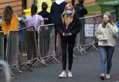 Students walk at a pop-up testing centre for Covid-19 in Glasgow, Scotland on September 24, 2020 Students walk at a pop-up testing centre for Covid-19 in Glasgow, Scotland on September 24, 2020