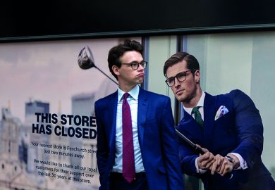A businessman pauses next to a closed shop poster featuring a similar man also wearing a blue suit and enjoying leisure time on the golf course A businessman pauses next to a closed shop poster featuring a similar man also wearing a blue suit and enjoying leisure time on the golf course