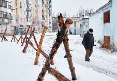 Man by fence in Ukraine