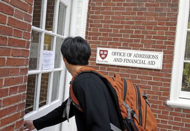 Freshman entering Harvard admissions building