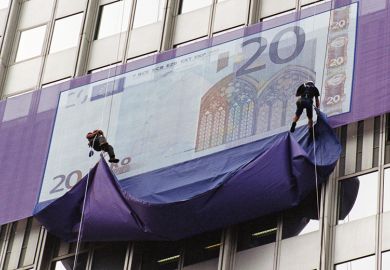 giant Euro note being unveiled by abseilers. Money