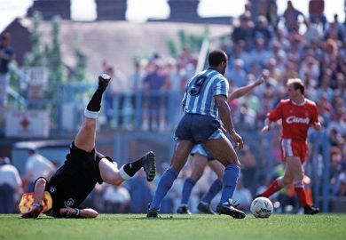 Football player falling over