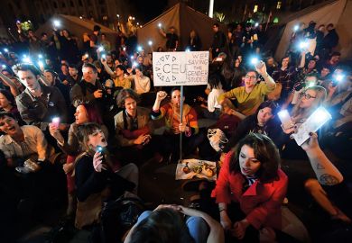 People protest at the parliament building at Budapest on April 4, 2017