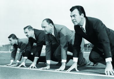 Businessmen on racetrack start line