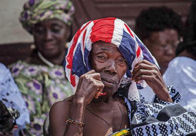 African person with British flag on their head