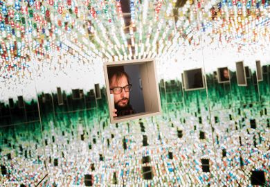 A man looking through a small window at many things A man looking through a small window at many things