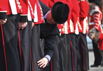 Master Taylor checks the cut of an Irish Guard's uniform