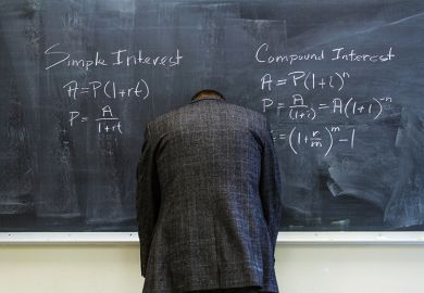 A teacher turned to face the blackboard A teacher turned to face the blackboard