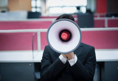 A person obscured by a megaphone
