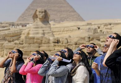 People viewing solar eclipse, Pyramids of Giza, Sphinx, Egypt