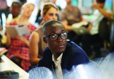 Male university student listening to seminar Male university student listening to seminar