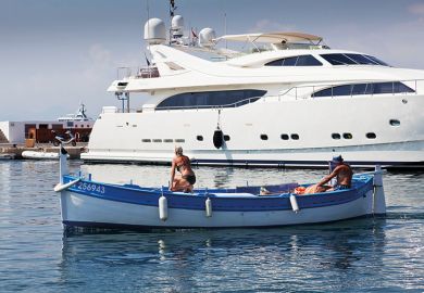 rowing boat in front of yacht.jpg