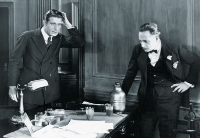 Two men looking surprised in an office
