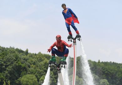 Motorboat athletes dressed as superman and spiderman compete on Tongsheng Lake on July 14, 2017 in Changsha, Hunan Province of China