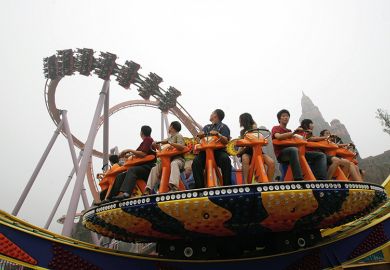 Tourists enjoy the amusement facilities at Chinese Theme Park, Beijing of China