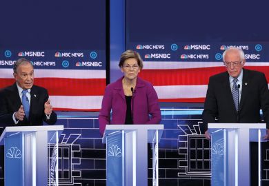Democratic presidential candidate former New York City Mayor Mike Bloomberg, speaks as Sen. Elizabeth Warren (D-MA) and Sen. Bernie Sanders (I-VT) listen during the Democratic presidential primary debate at Paris Las Vegas on February 19, 2020. Democratic presidential candidate former New York City Mayor Mike Bloomberg, speaks as Sen. Elizabeth Warren (D-MA) and Sen. Bernie Sanders (I-VT) listen during the Democratic presidential primary debate at Paris Las Vegas on February 19, 2020.