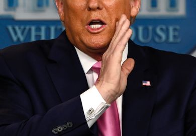 US President Donald Trump gestures as he speaks during a news conference on the COVID-19 outbreak at the White House on February 26, 2020