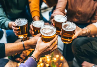 Toasting with glasses of beer