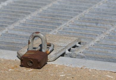 A locked trapdoor illustrating potential downgrade of Chinese PhD students to a master’s programme
