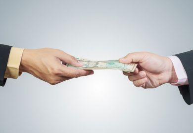 Two hands exchanging money