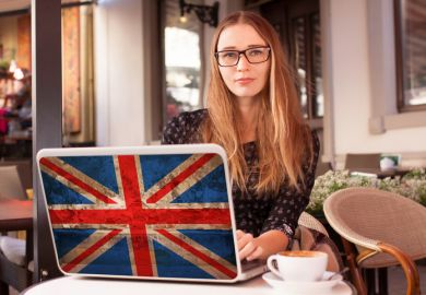 Student with British laptop