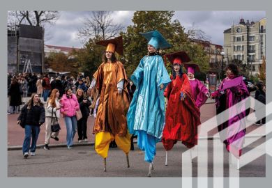 Students of Kyiv-Mohyla Academy walking on stilts celebrate the 409th birthday of the university in Kyiv, Ukraine, 15 October 2024. To illustrate the resilience of universities in Ukraine.