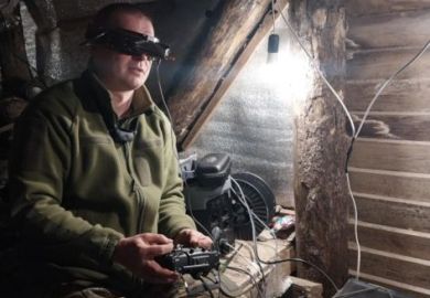 A Ukranian soldier operating a controller