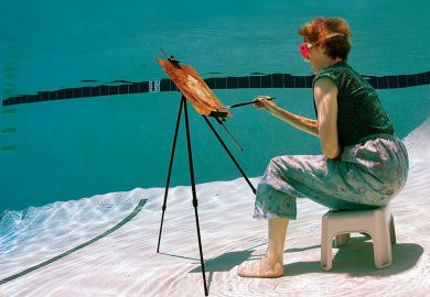 Woman painting underwater
