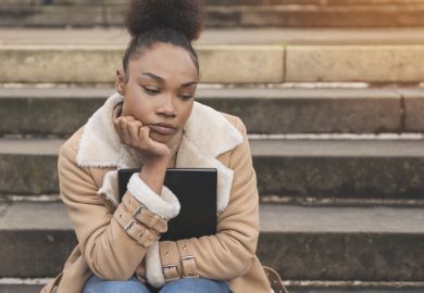 An unhappy black student waiting An unhappy black student waiting
