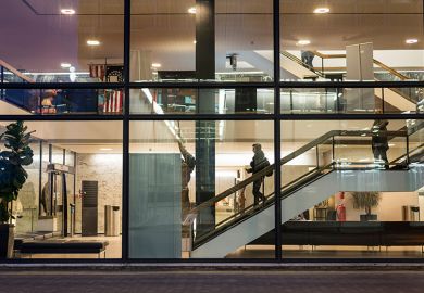 University of Sheffield campus at night. As an illustration that the benefits of working in academia, such as flexible hours, can also add to workload stress.