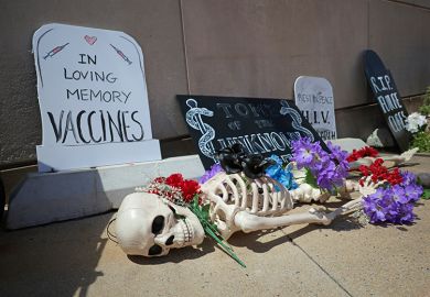 A memorial for the loss of funding for research and public health programs is placed in front of the National Institutes of Health (NIH), 10 May, 2025 in Bethesda, Maryland. A protest against Robert F. Kennedy, Jr.'s "Make America Healthy Again" movement.