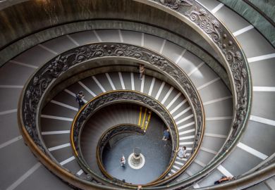 Vatican, Vatican - June 14 2019 People on Bramante Double Helix Staircase in Vatican Museums in the Vatican City.